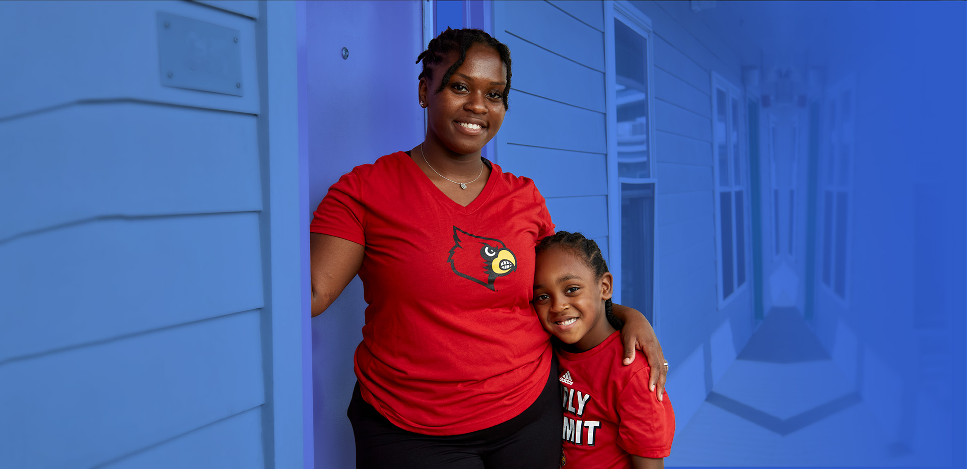 A mother holds her child at Family Scholar House